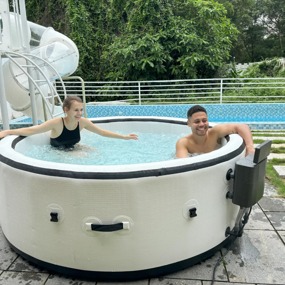 2 friends are enjoying a portable inflatable hot tub by the poolside