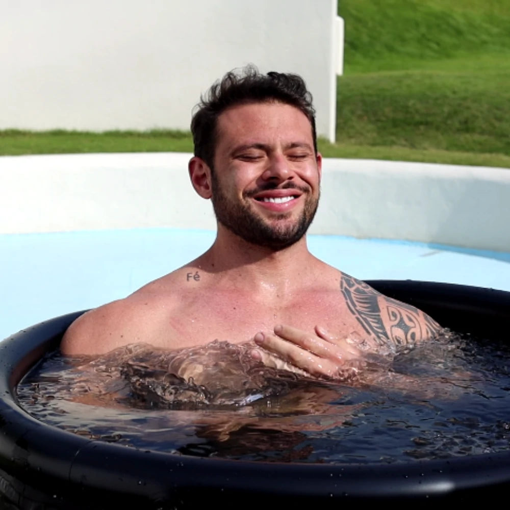 Man submerged in an ice bath for post-exercise muscle recovery.