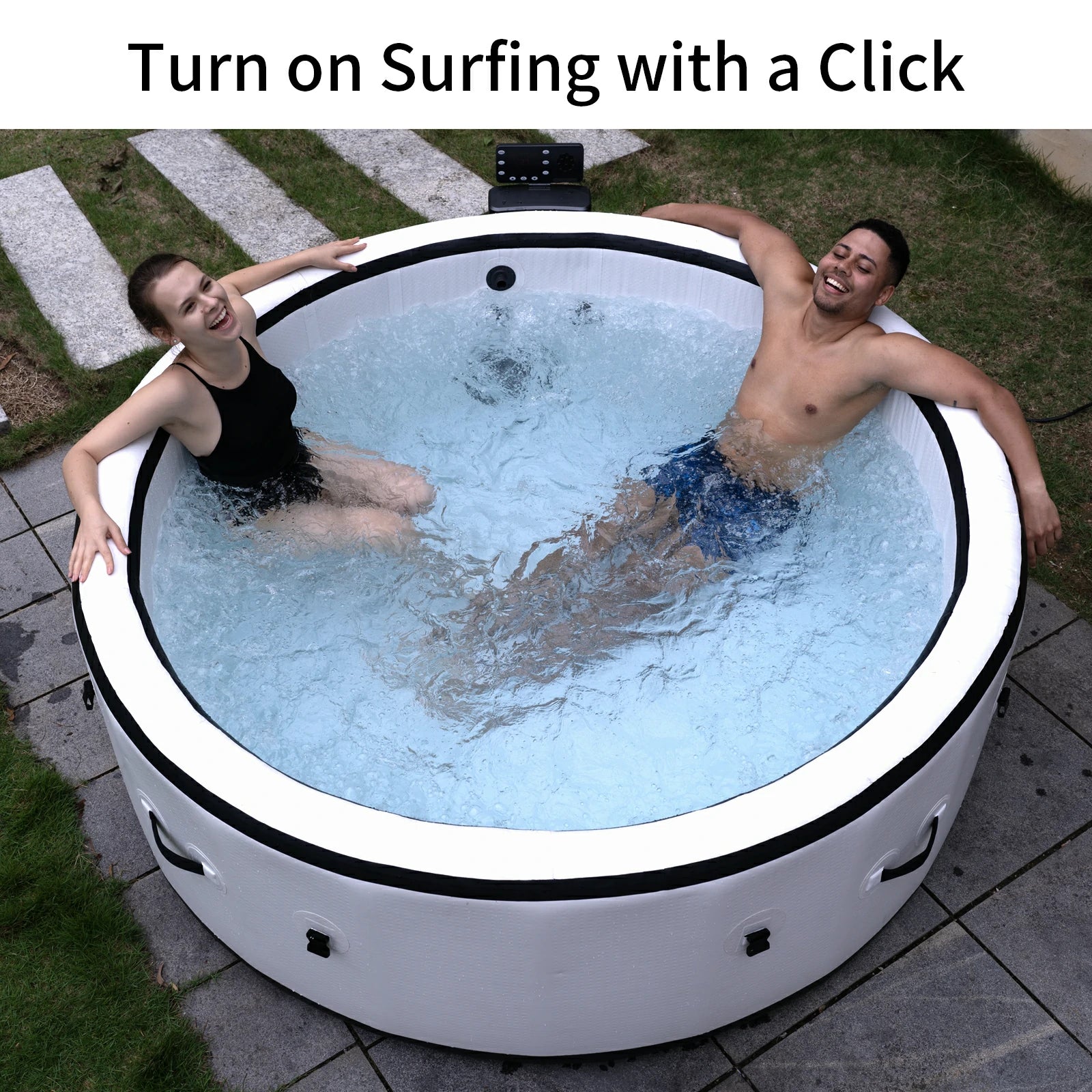 Two people relaxing in an inflatable hot tub, enjoying the water jets and surf massage feature. This portable spa pool offers an easy setup and comfortable outdoor experience.