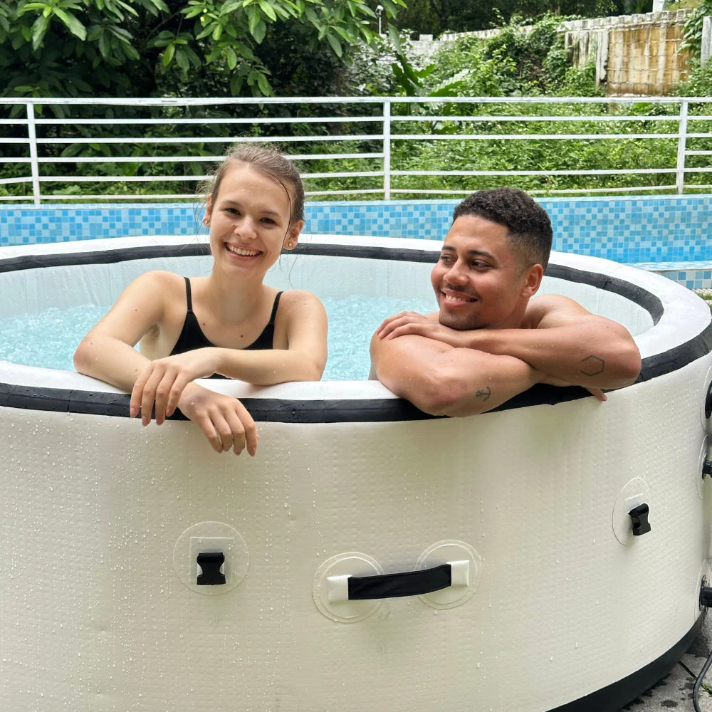2 friends are smiling and relaxing in a best-rated inflatable spa hot tub for backyard