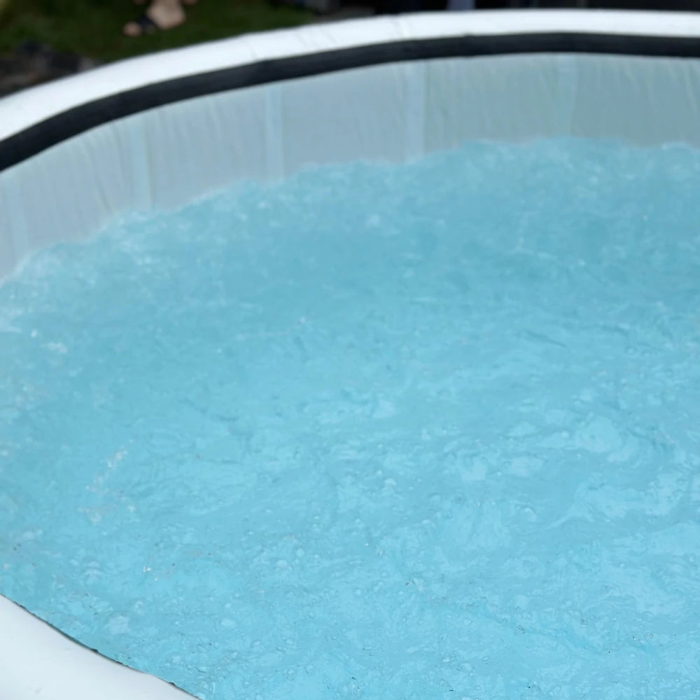 Close-up view of a filled inflatable hot tub showcasing the water's surface. Perfect for outdoor relaxation.